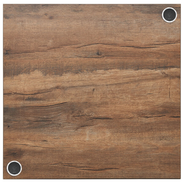 a wood surface with metal screws