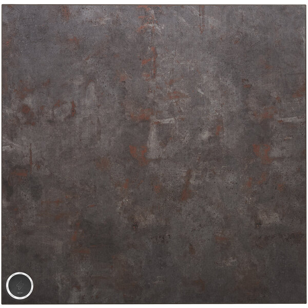 A grey square BFM Seating table top with a circle in the middle containing a wireless charger.