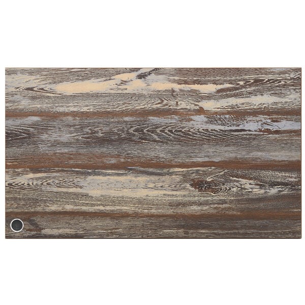 A BFM Seating Relic rectangular table top with a wood grained surface and a circular metal wireless charger.
