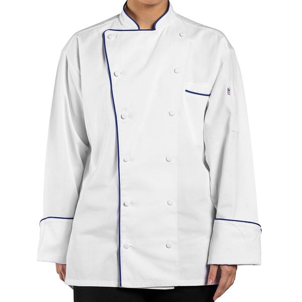 A person wearing a Uncommon Chef white chef coat with royal blue piping.