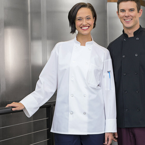 A man and woman wearing Uncommon Chef white chef coats with mesh venting.