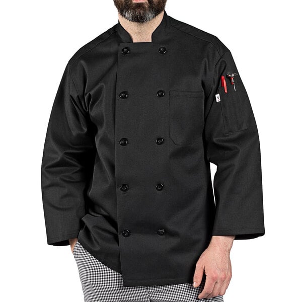 a man wearing a black chef coat