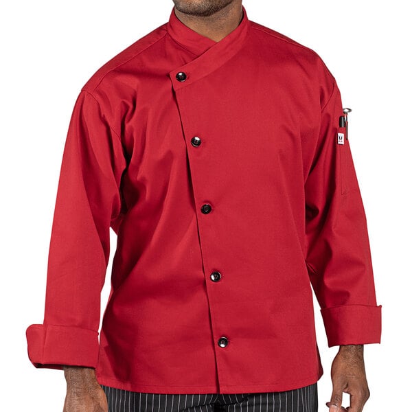 A man wearing a Uncommon Chef red long sleeve chef coat.