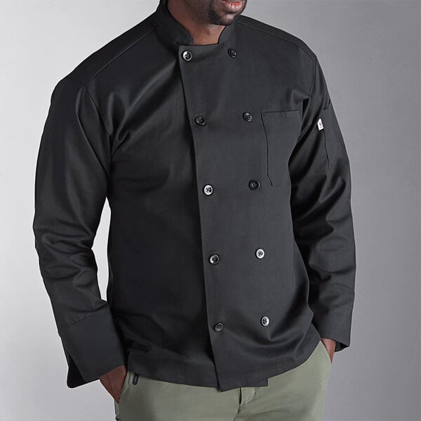 A man wearing a black Uncommon Chef long sleeve chef coat.