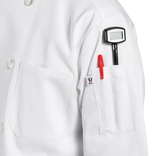 a person wearing a white coat with a pen in the pocket