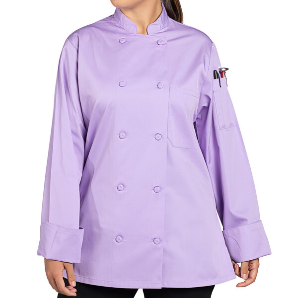 A woman wearing a lilac Uncommon Chef long sleeve chef coat.