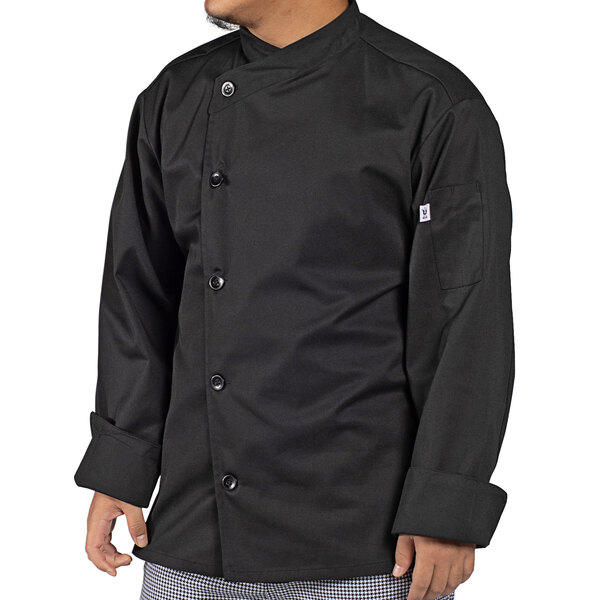 A man wearing a black Uncommon Chef long sleeve chef coat.