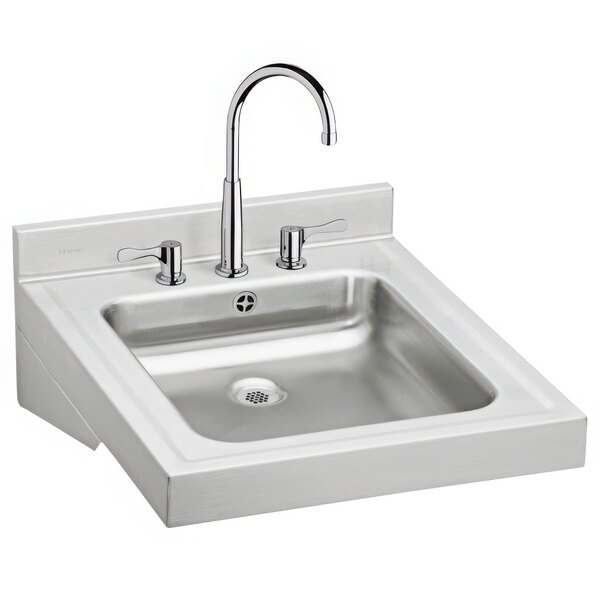 A silver Zurn wall hung lavatory sink with faucets.