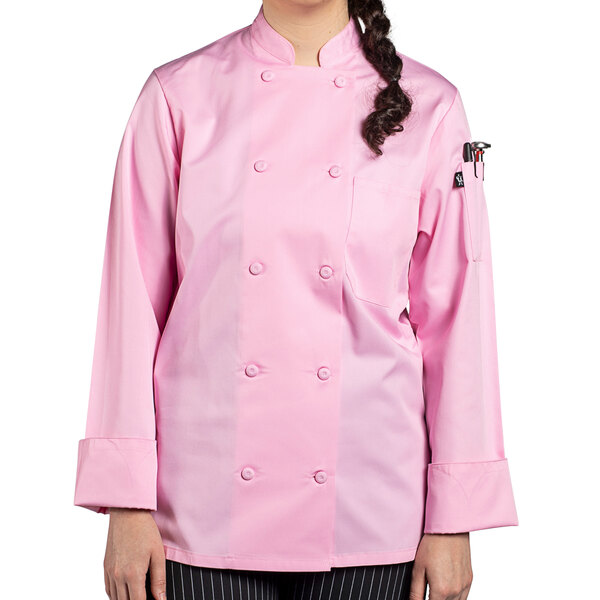 A woman wearing an Uncommon Chef pink long sleeve chef coat with a mesh back.