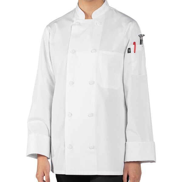 A person wearing a white Uncommon Chef long sleeve chef coat.