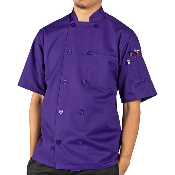 A person wearing a purple Uncommon Chef short sleeve chef coat.