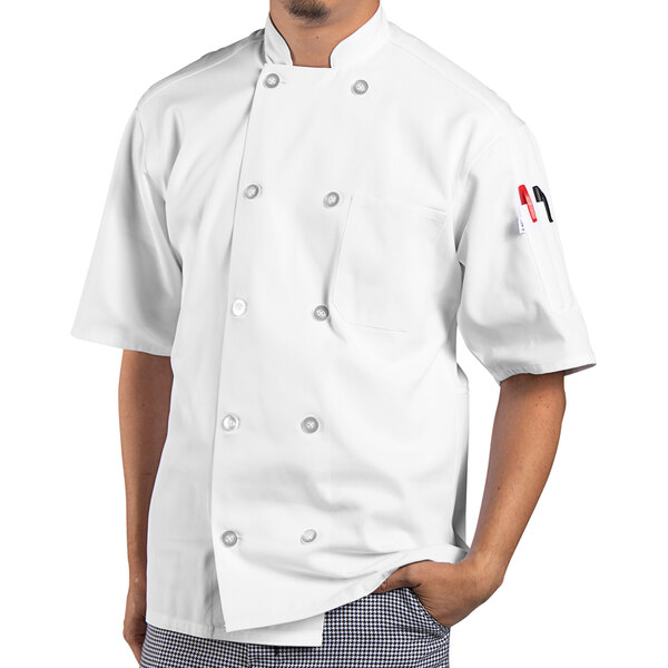 A man wearing a white Uncommon Chef short sleeve chef coat.