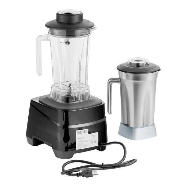 A commercial blender with a black base, a clear polycarbonate jar, and a separate stainless steel jar.