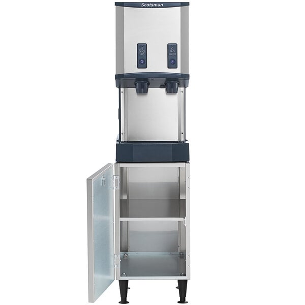 A Scotsman Meridian ice and water dispenser machine with a door open.