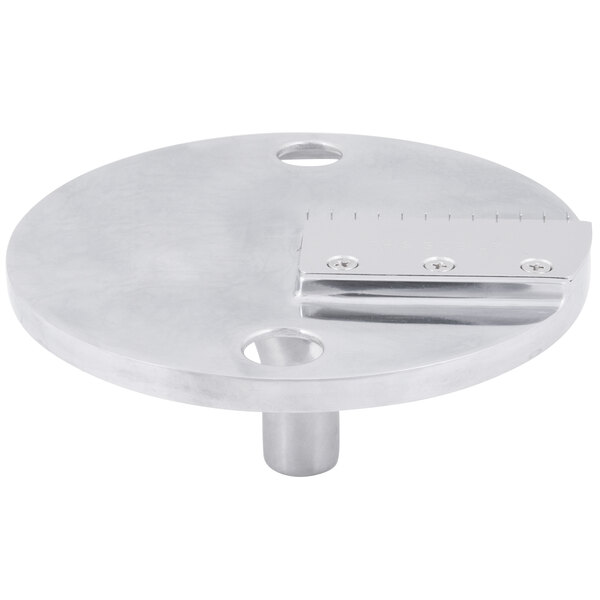 A round stainless steel Waring julienne disc with holes.
