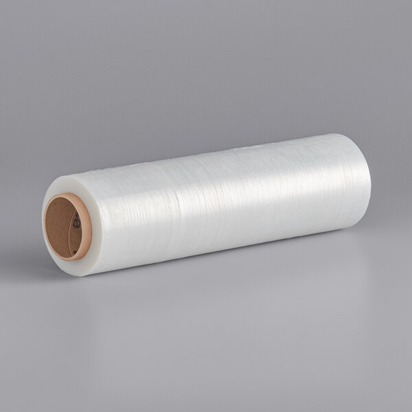 A roll of Lavex clear plastic hand pallet wrap on a gray surface.