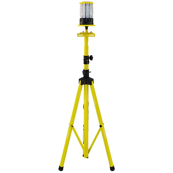 A yellow tripod with a Lind Equipment Beacon360 LED portable area light on it.