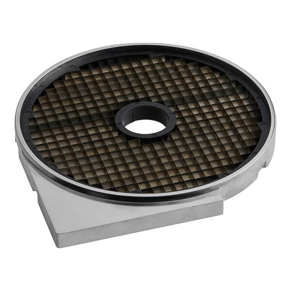 A circular metal dicing grid with a hole in the middle.