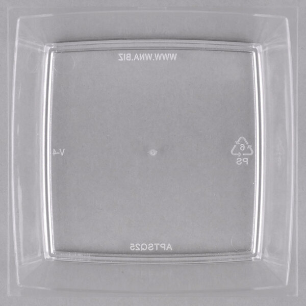 A clear plastic square dish.