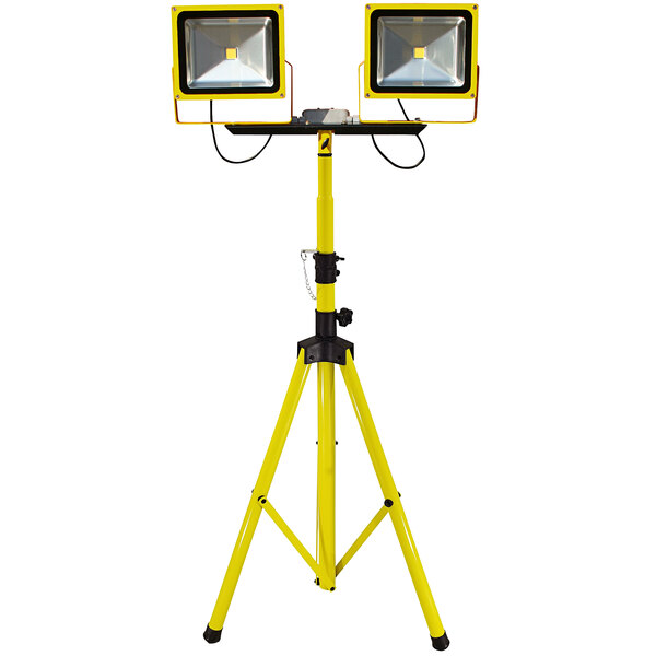 A yellow Lind Equipment tripod with two yellow LED work lights.