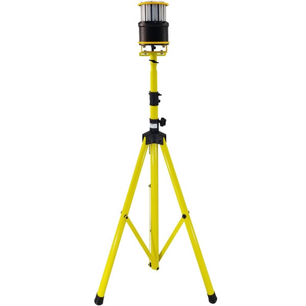 A yellow tripod with a black Lind Equipment LED light on it.