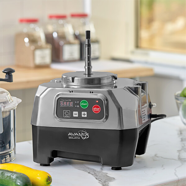 An AvaMix motor base for a food processor on a counter in a professional kitchen.