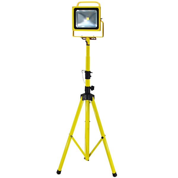 A yellow Lind Equipment tripod stand with a LED light on top.