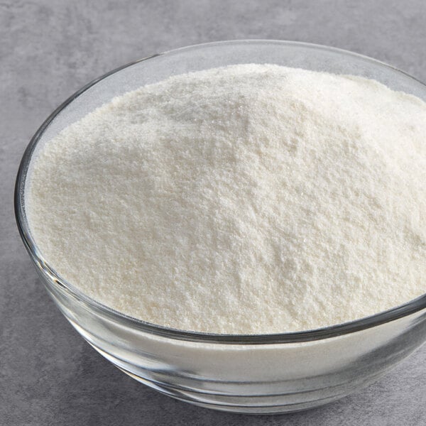 A bowl of Frostline Vanilla Soft Serve Ice Cream Mix powder.