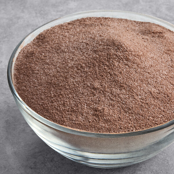 A bowl of Frostline Chocolate soft serve ice cream mix powder.