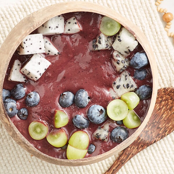 A bowl of Pitaya Foods smoothie with fruit.