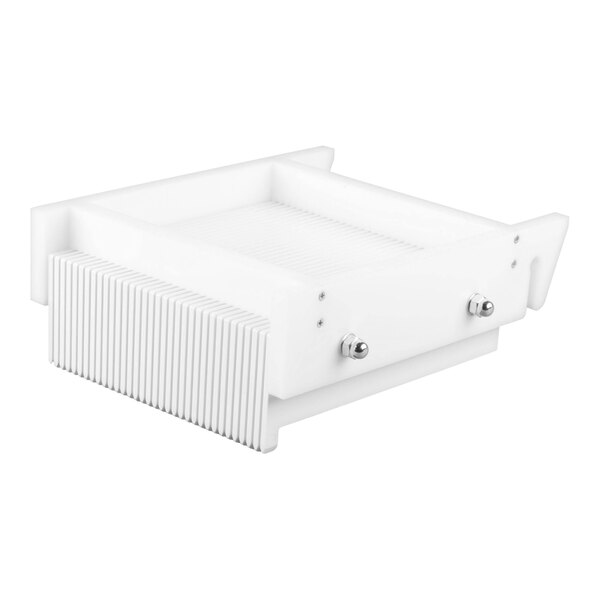 A white rectangular device with metal knobs and parallel cutting wires, designed for slicing candies or similar items.