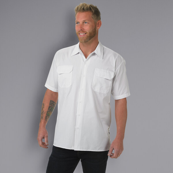 A man wearing a white Mercer Culinary work shirt.