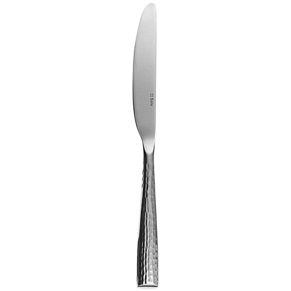 A Sola stainless steel table knife with a silver handle and blade.