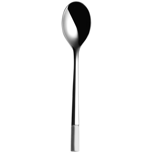 A Sola stainless steel teaspoon with a black handle.