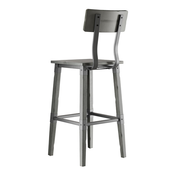 A slate gray industrial-style bar stool with a solid wood seat, backrest, and four legs.