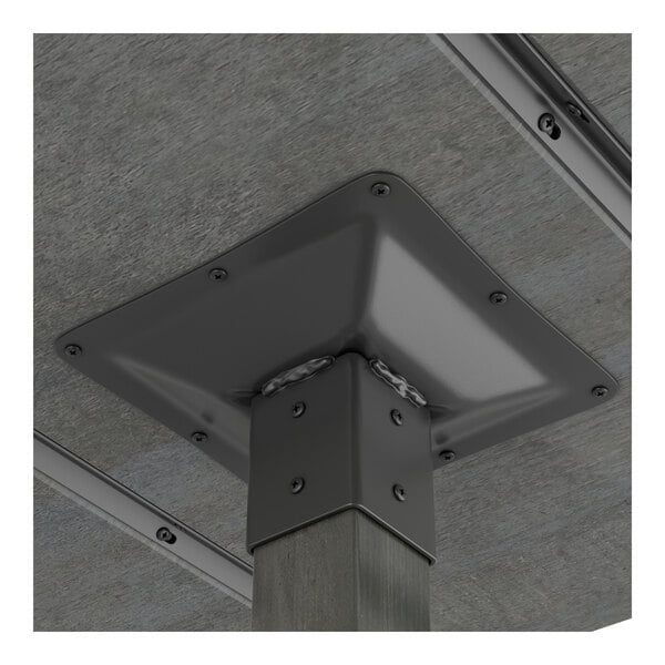 A close-up view of the metal mounting bracket securing a wooden table leg to the underside of a table.