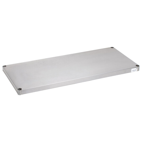 A rectangular stainless steel surface with screws.