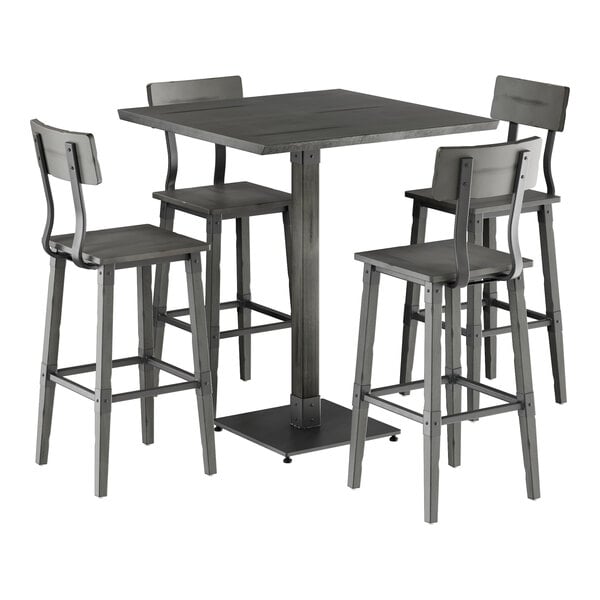 A Lancaster Table & Seating industrial bar height table with live edge detail, slate gray finish, and four bar stools.