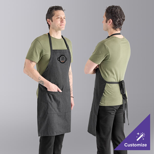 A man wearing a gray Uncommon Chef butcher apron with triple pinstripes.