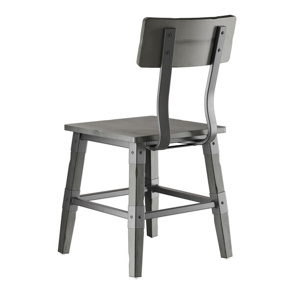 A slate gray wooden chair with a solid seat, angled legs, and a rectangular backrest.
