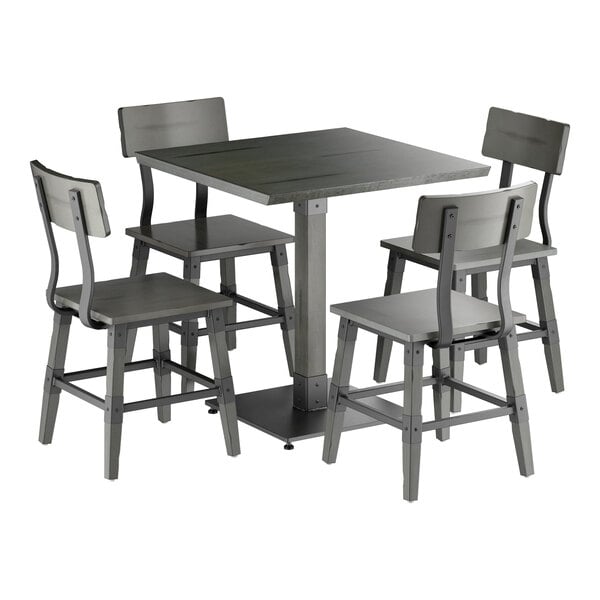 A square gray table with a central pedestal base, surrounded by four matching gray chairs with backrests.