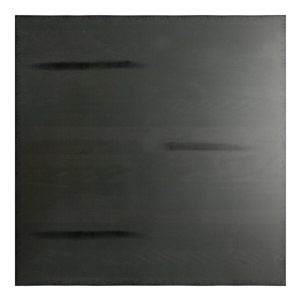 A square, dark gray surface with a subtle wood grain texture and faint horizontal streaks.