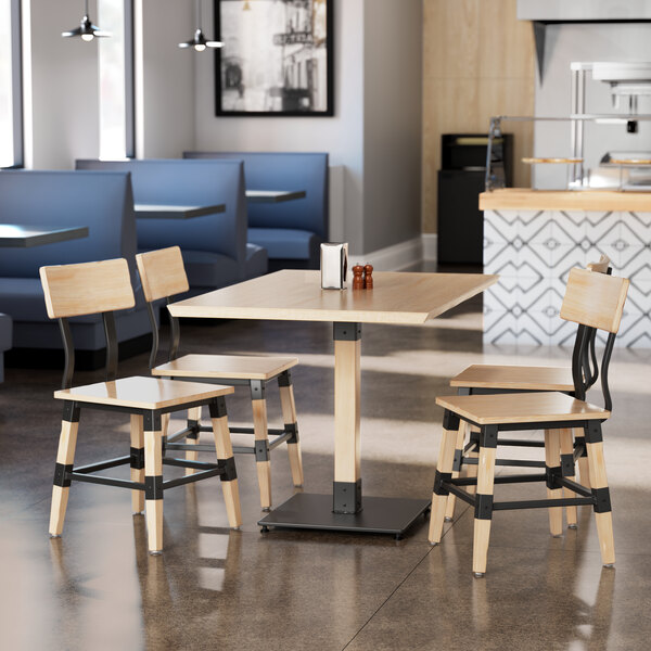 a wooden table with a salt and pepper shaker