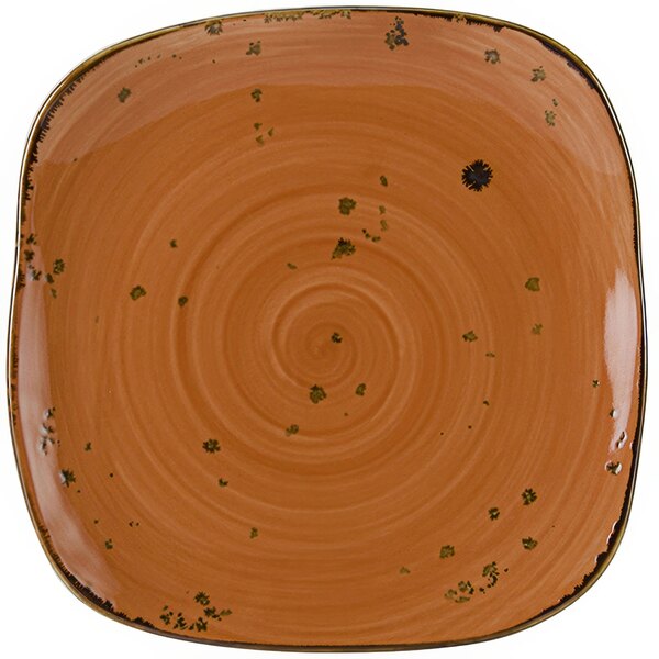 A Tuxton square china plate with a brown and orange swirl design.