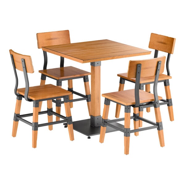 A wooden square table with a honey maple finish, accompanied by four matching chairs featuring metal accents and wooden seats and backs.