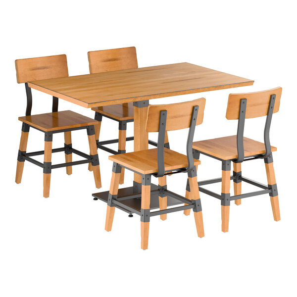 A wooden dining table with a honey maple finish and four matching chairs featuring metal accents.