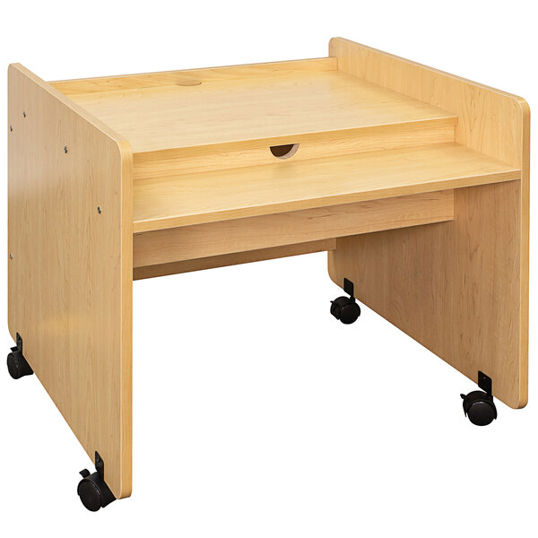A Tot Mate maple laminate mobile desk with wheels.