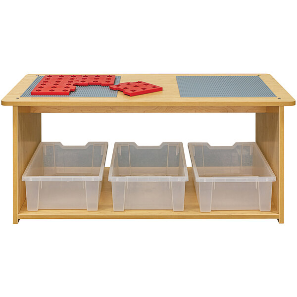 A maple wood preschool play center with plastic bins on top.