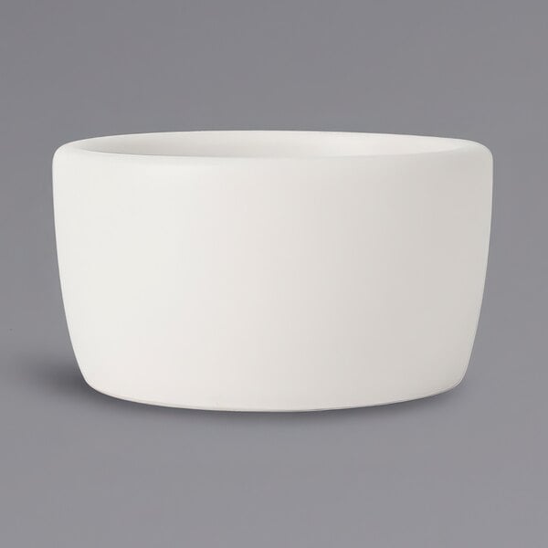 A Tuxton TuxTrendz white china ramekin.