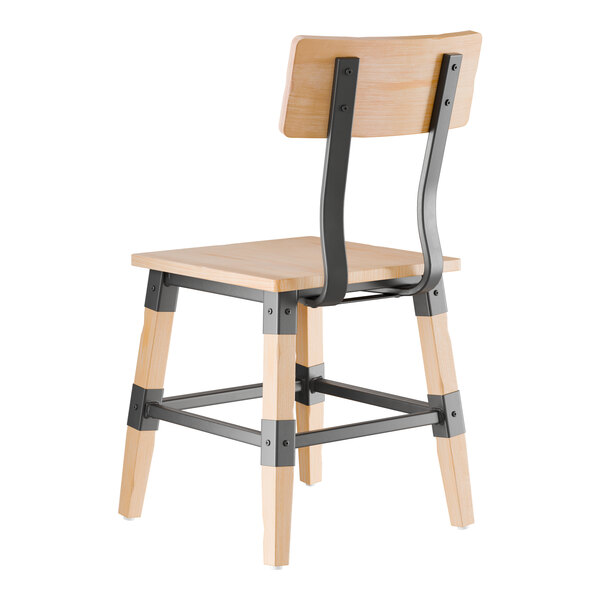 A wooden chair with a bleached oak finish and black metal supports, shown from the back.